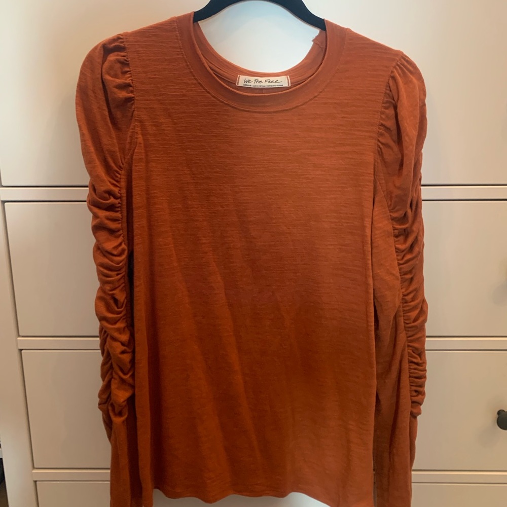 We The Free Natasha rust colored slub tee shirt with ruched sleeves.